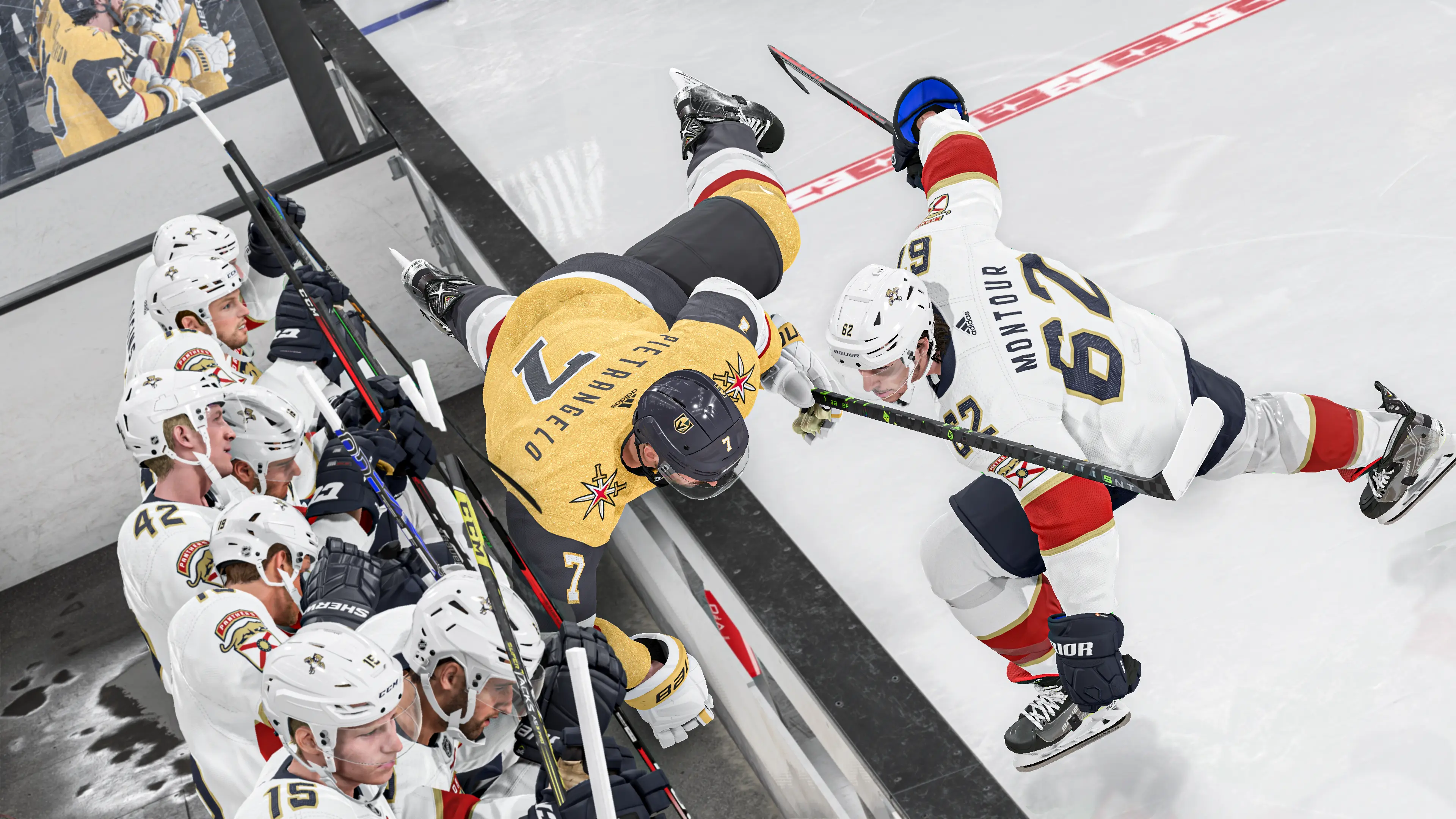 A player in NHL 24 is tackled over the side into the opposing team's sub bench.