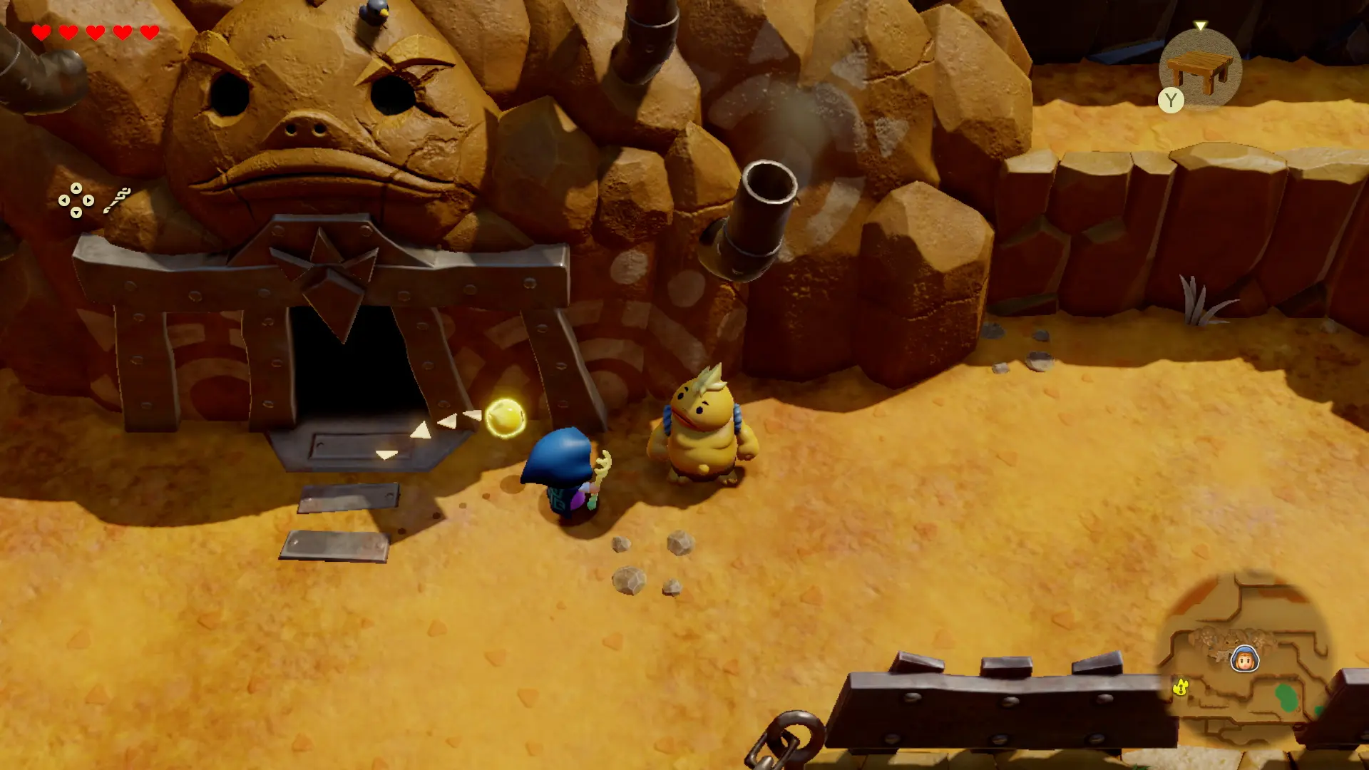 Zelda stands next to a Goron outside Goron City in The Legend of Zelda: Echoes of Wisdom video game