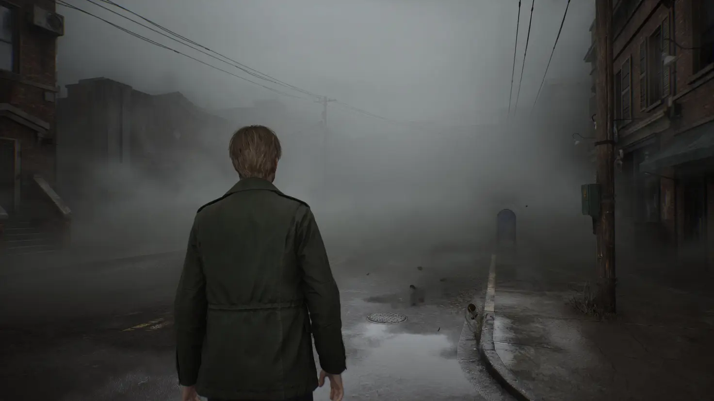 James Sunderland walks into a foggy town street in Silent Hill 2