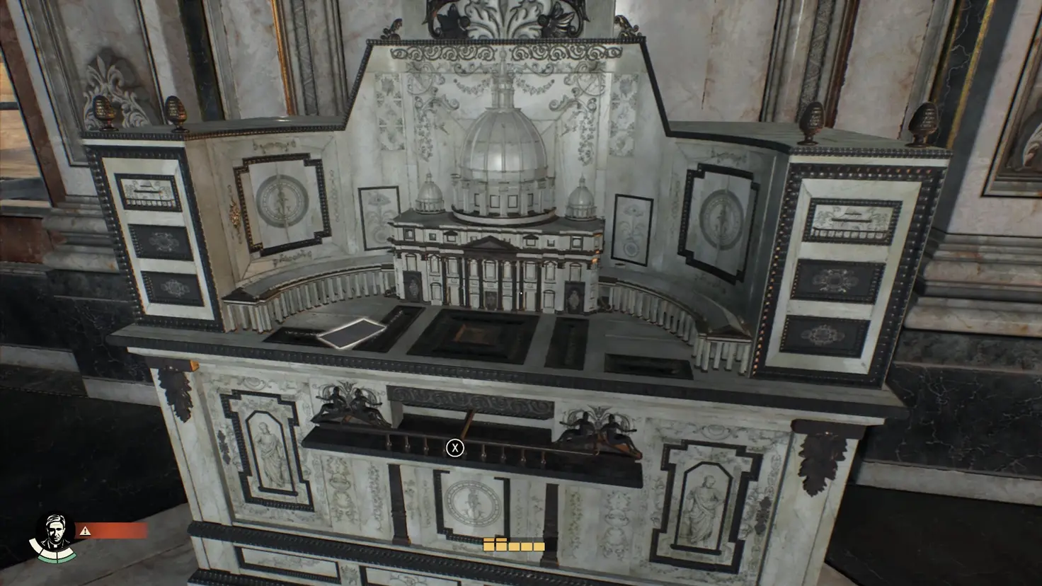 A model of an elaborate house of gold with a level the player can interact with