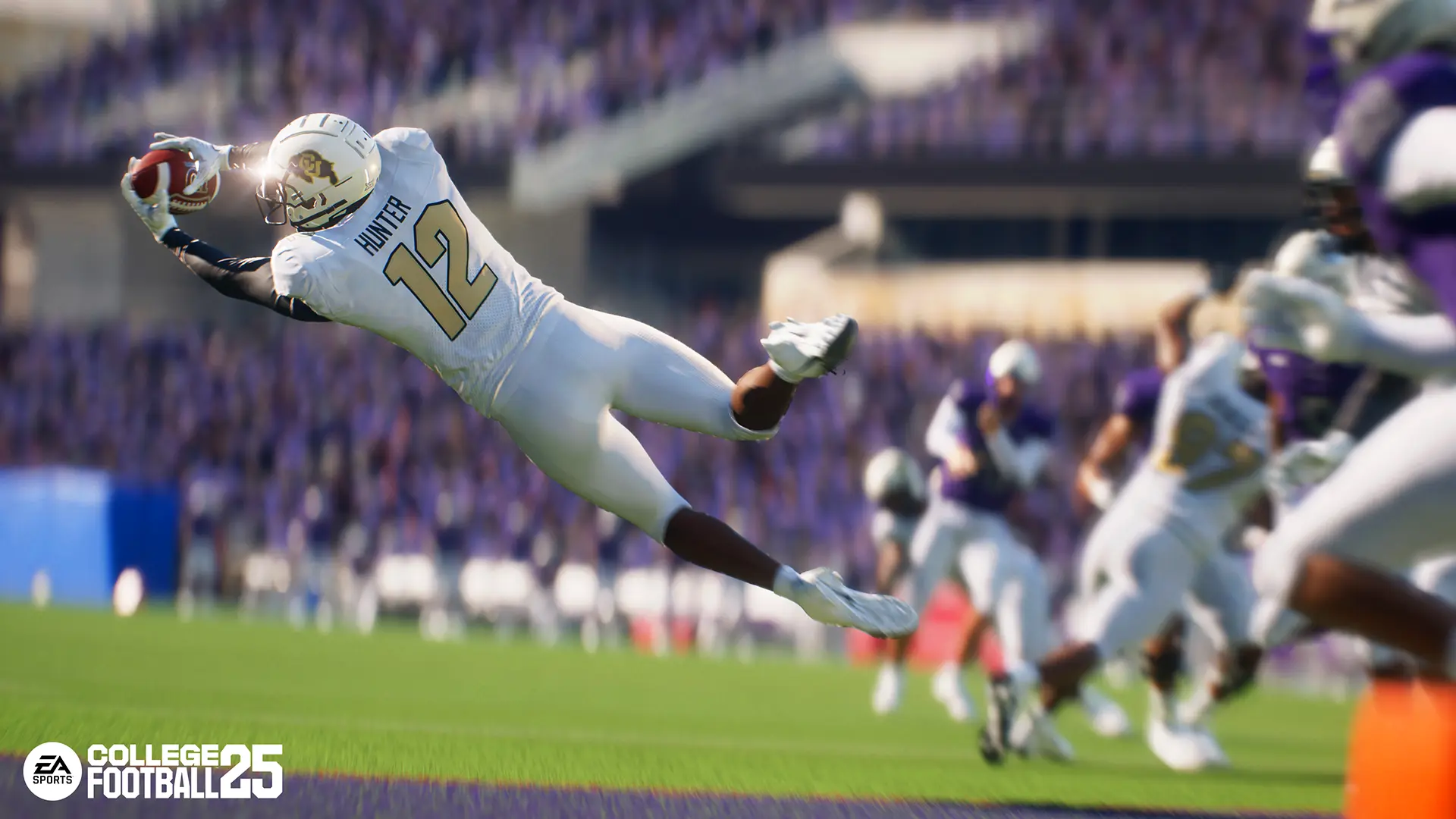 Colorado Buffaloes cornerback Travis Hunter dives to catch the football during a game