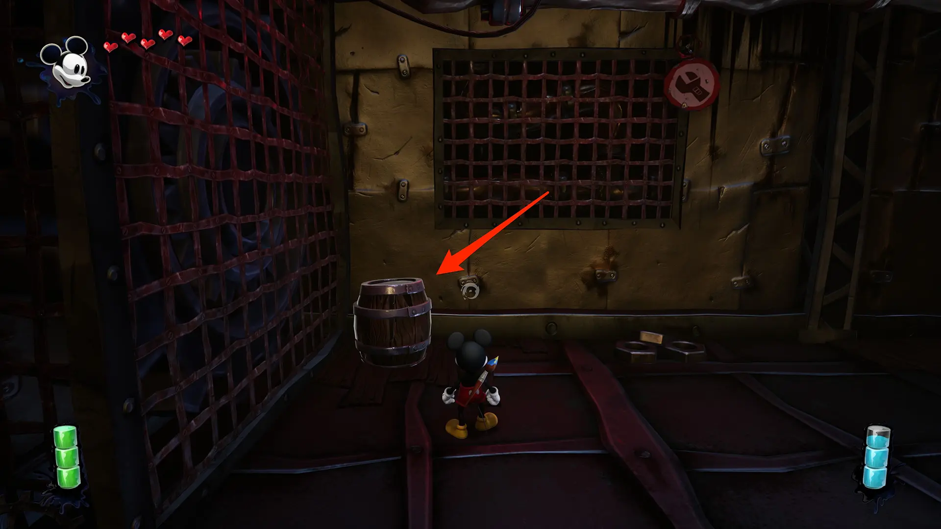 A red arrow points at a breakable barrel in the Epic Mickey: Rebrushed video game