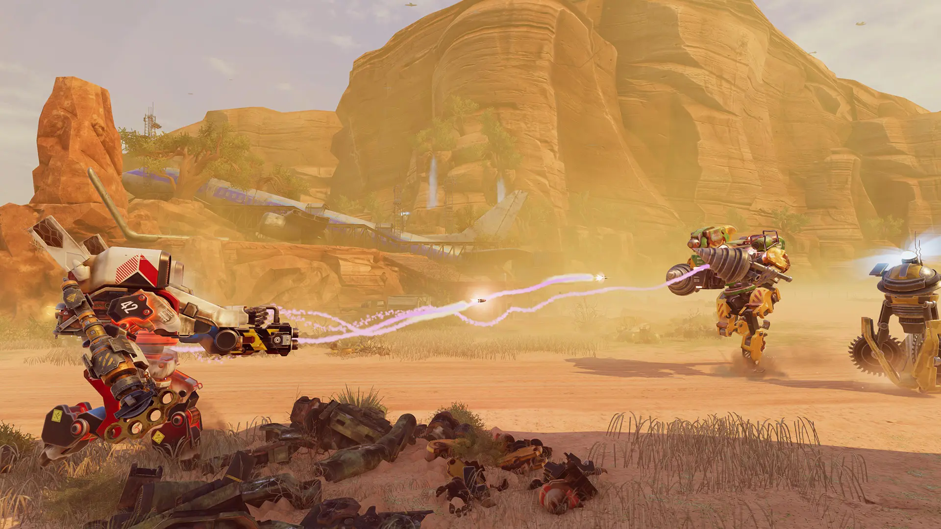 Two mechs shoot weapons at each other in a desert environment