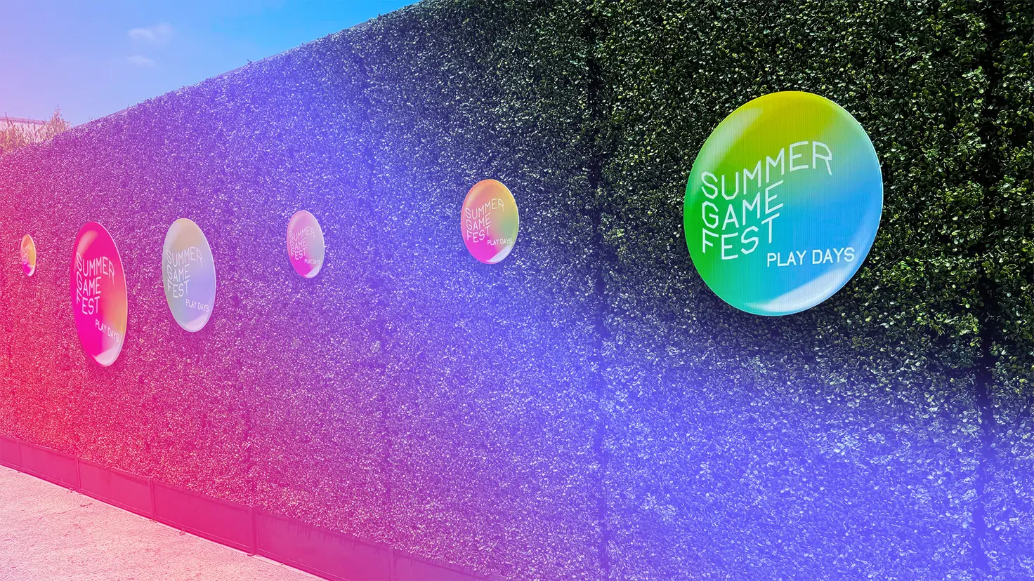 A hedge at Summer Game Fest 2024 with circles advertising the Summer Game Fest Play Days event.