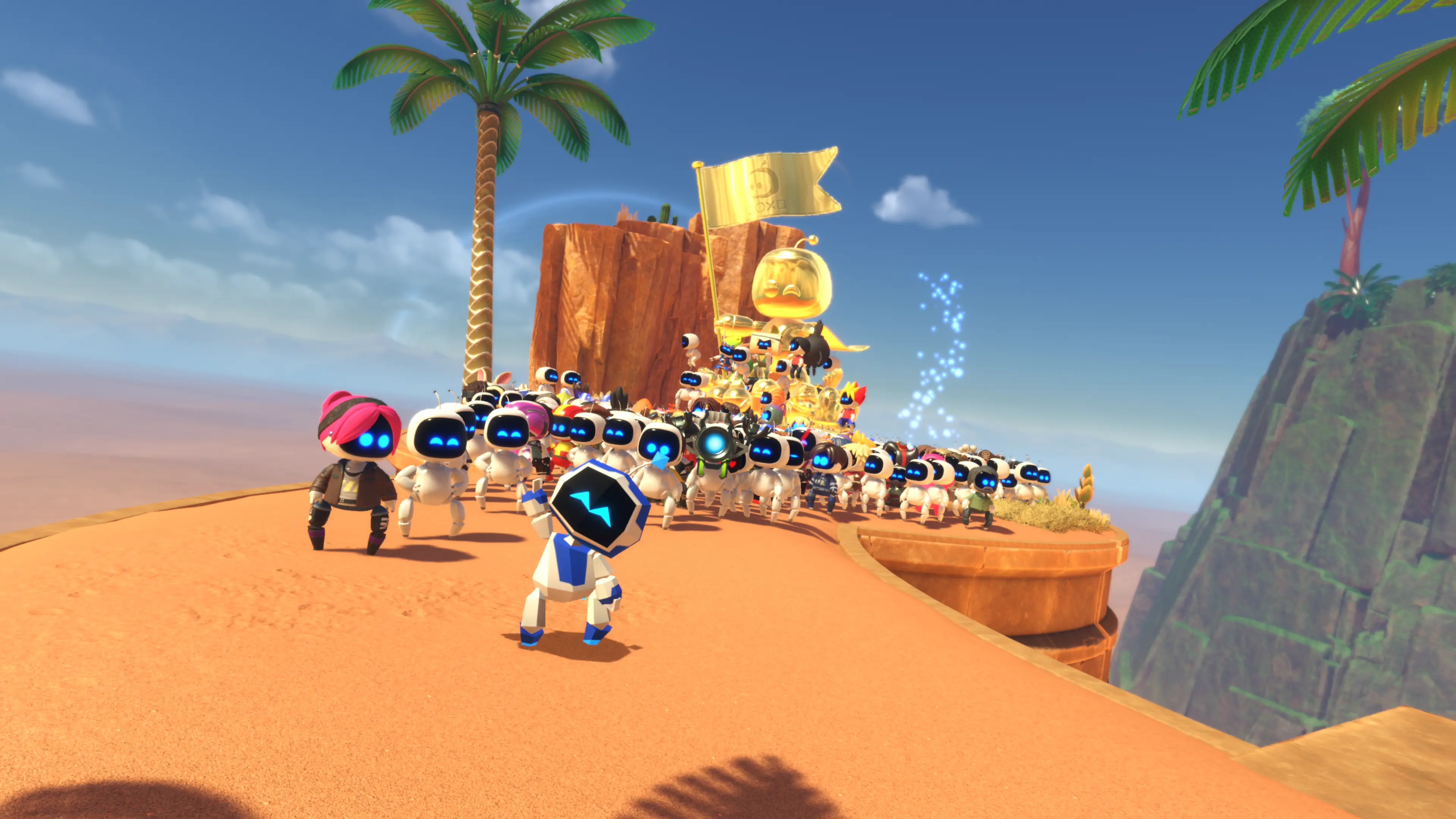 Astro Bot stands in front of hundreds of other bots, waving to the camera.