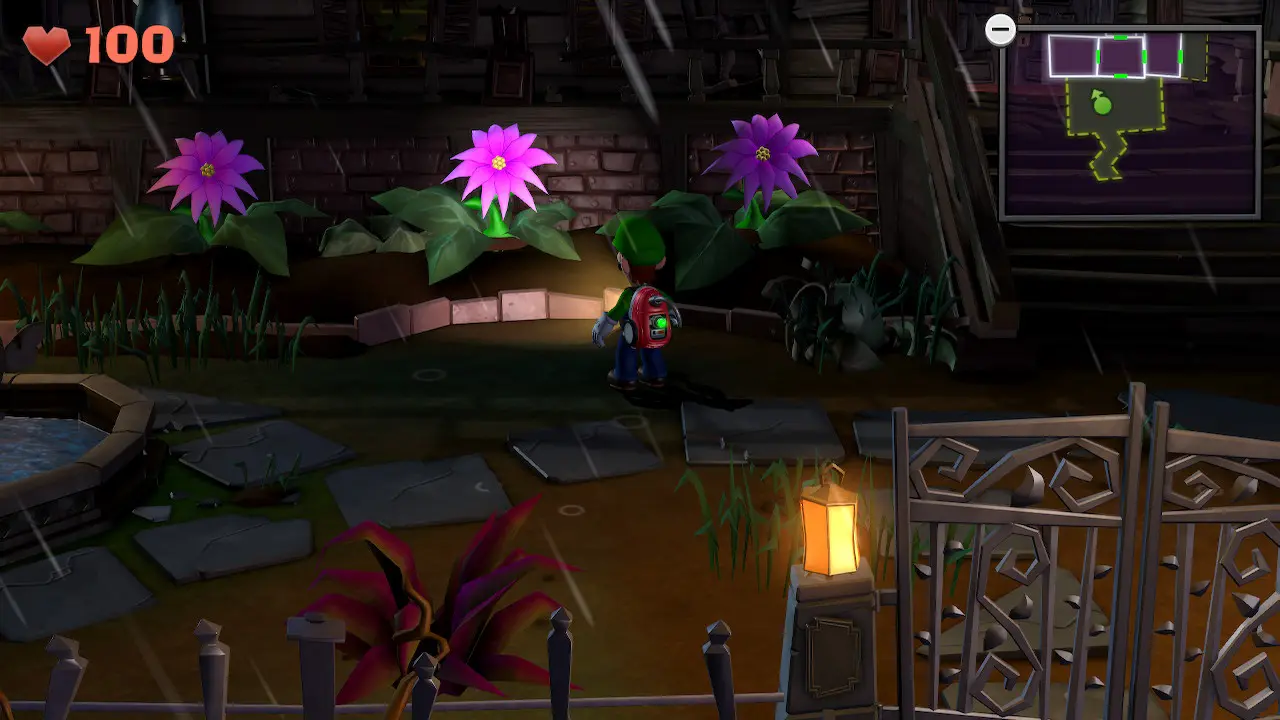 Pink flowers blooming in the front yard of a spooky mansion in the Luigi's Mansion 2 HD video game