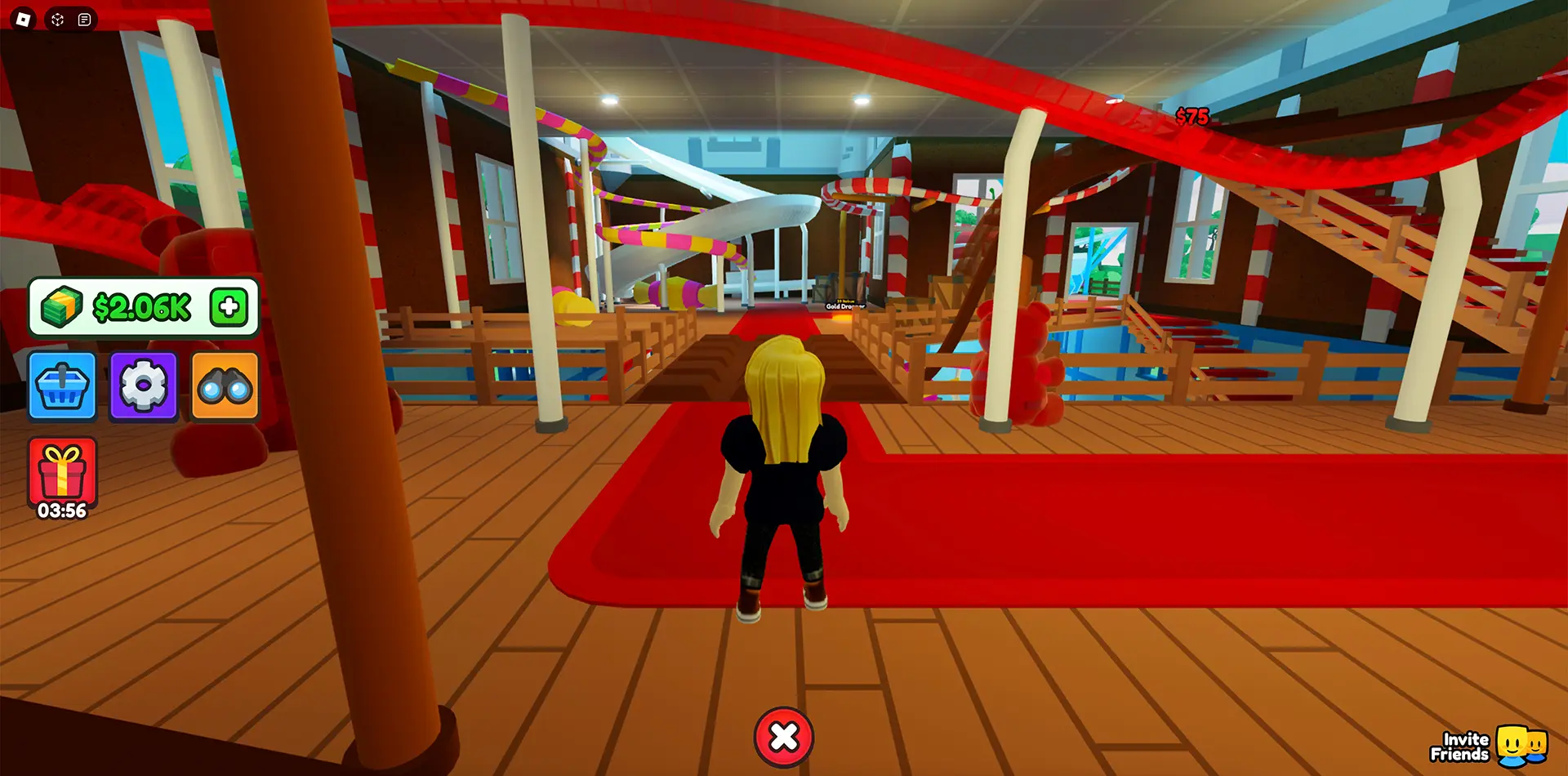 A Roblox player stands near a complex marble run in the Marble Run Tycoon 2 Roblox experience