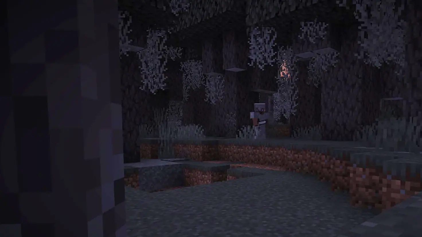 A Minecraft player wearing iron armor and holding an iron sword stands in the Pale Garden biome