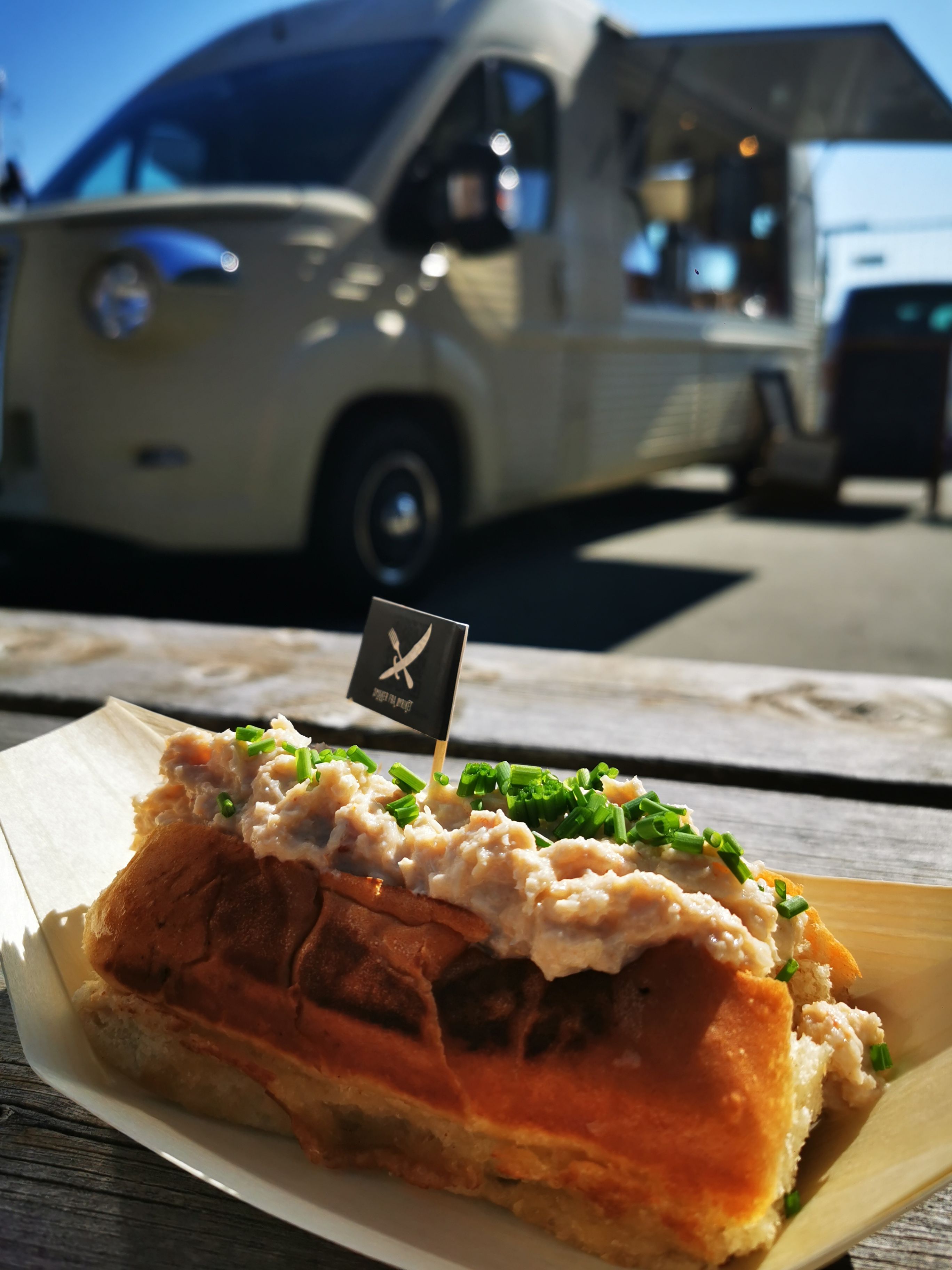 Sandwhich in front of a food truck