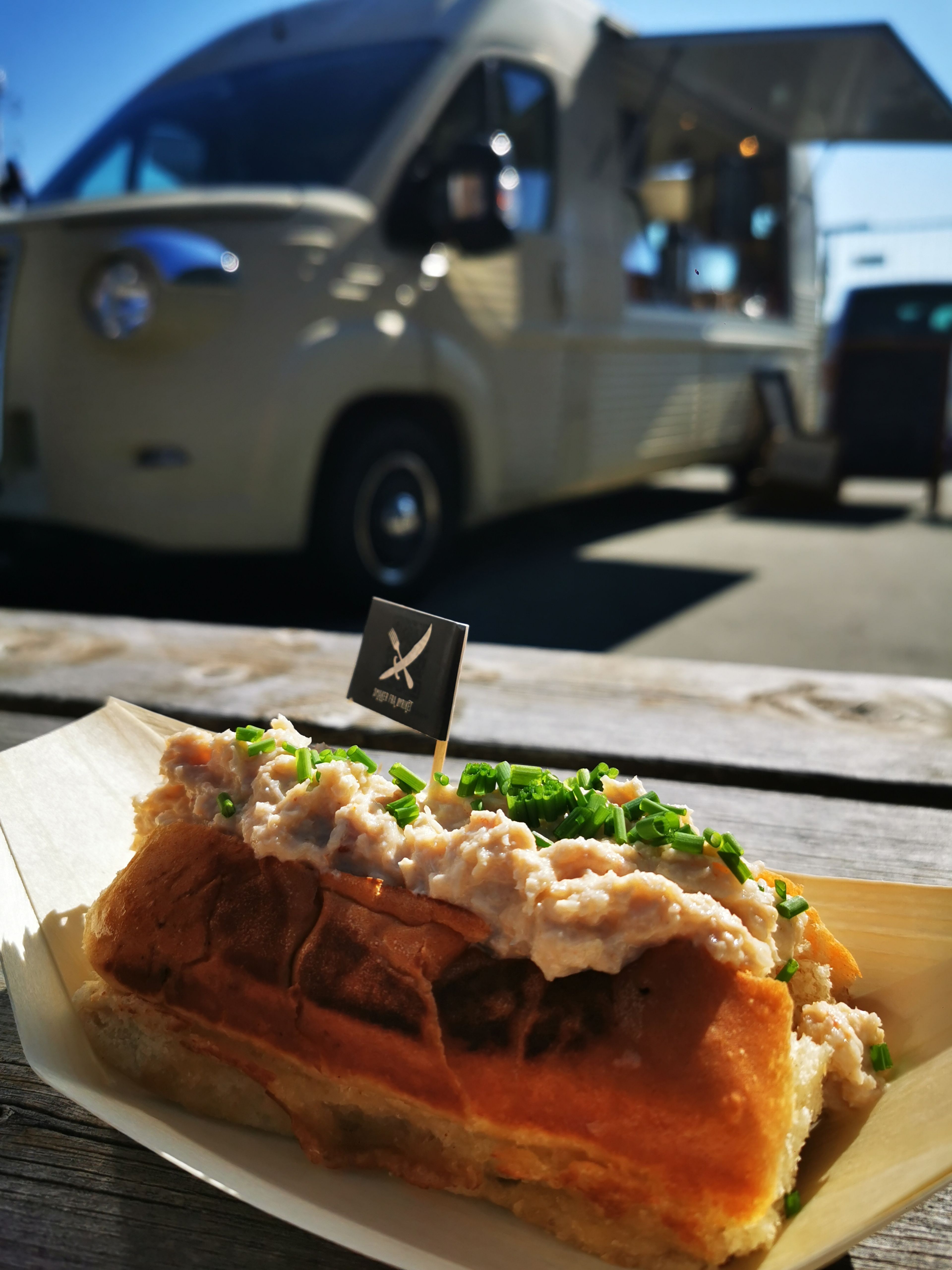Sandwhich in front of a food truck