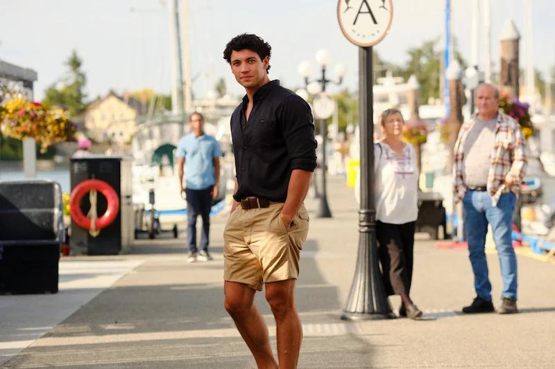Cam Dillinger (Kyle Clark) walking along the dock at Port Sidney Marina in Crew Girl.
