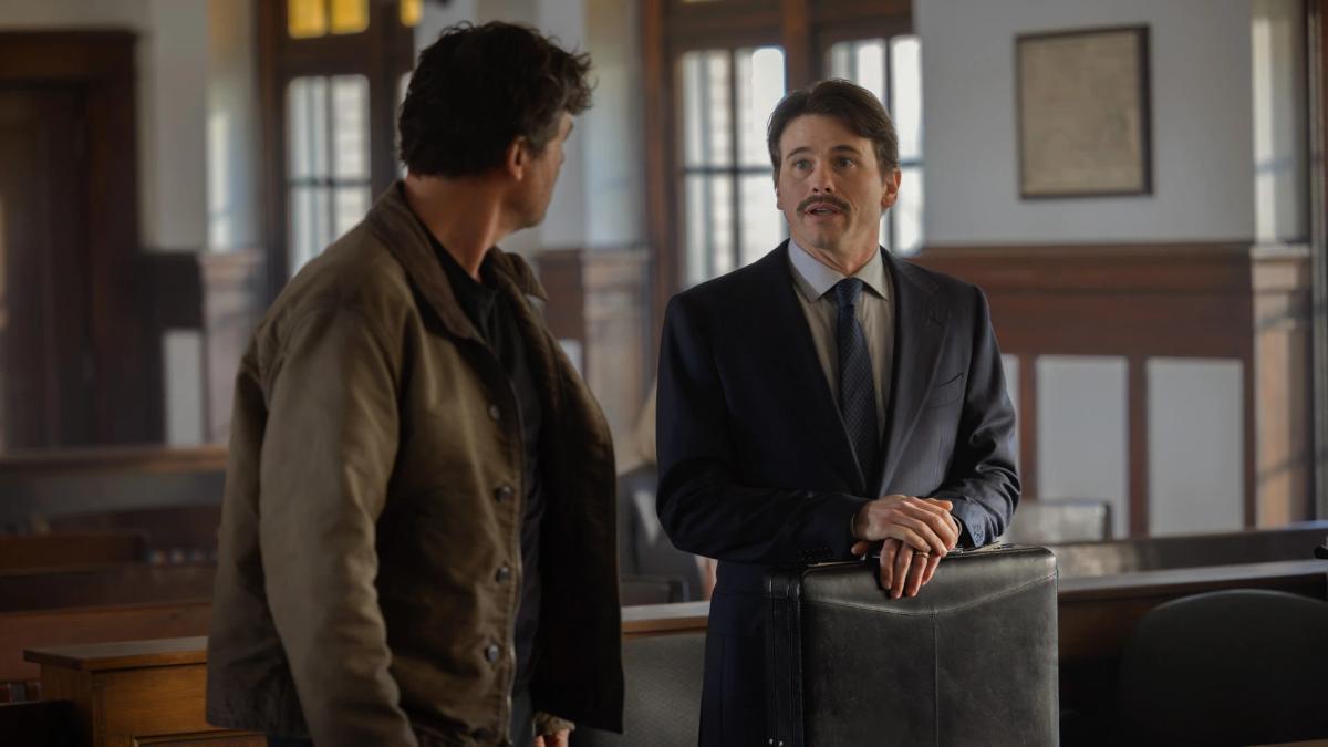 Kyle Chandler as Hal Jordan speaking with Jason Ritter as lawyer Billy Macon in a Nebraska courthouse