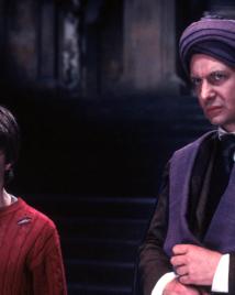 Daniel Radcliffe as Harry Potter faces Ian Hart as Professor Quirrell in the chamber beneath Hogwarts.