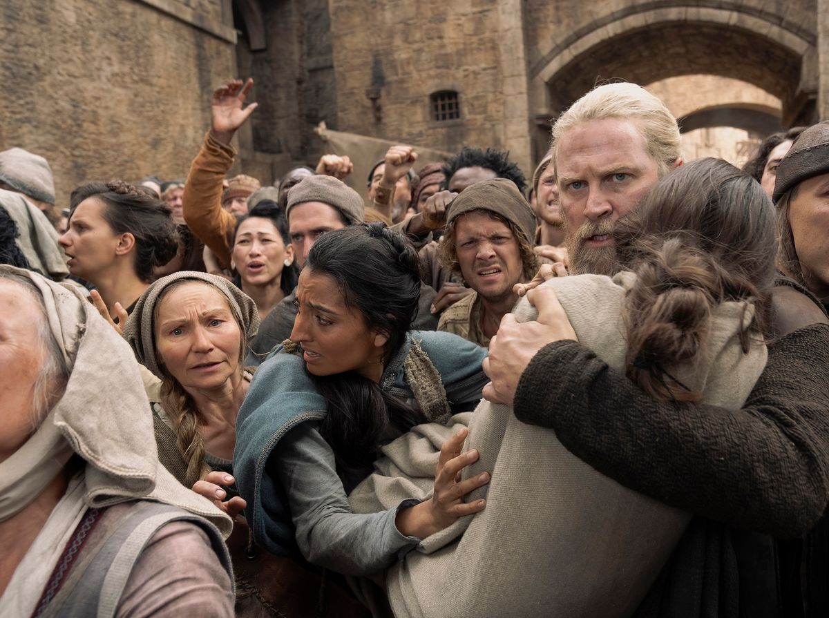 Hugh Hammer carrying her daughter in a mob