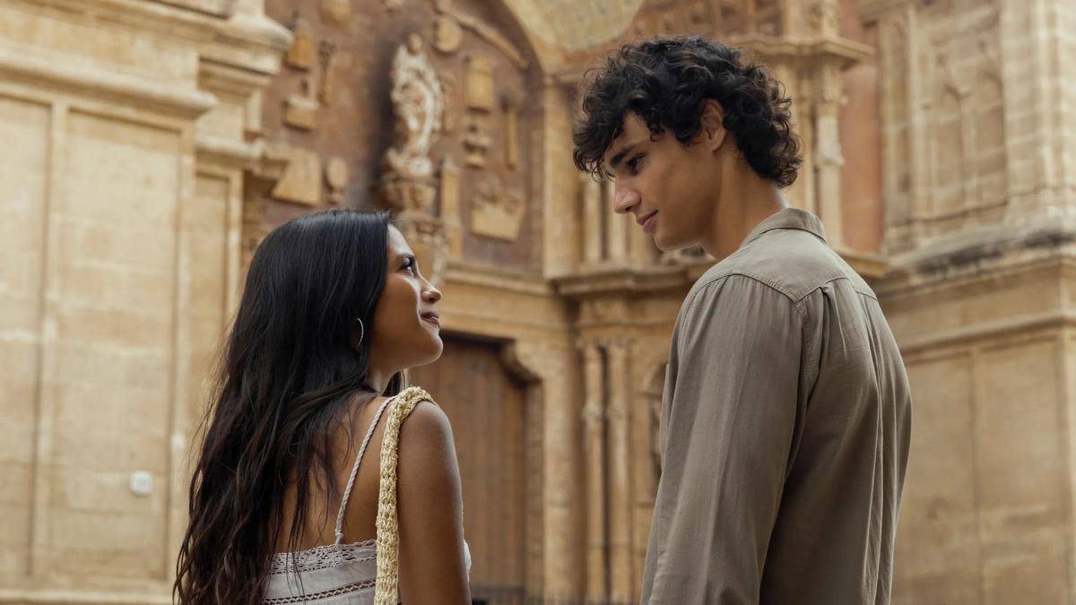 Maia Reficco as Oriah "Ry" Pera and Fernando Lindez as Julián García facing each other outside a stone church.