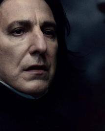 Alan Rickman as Severus Snape looks ahead on the Astronomy Tower.
