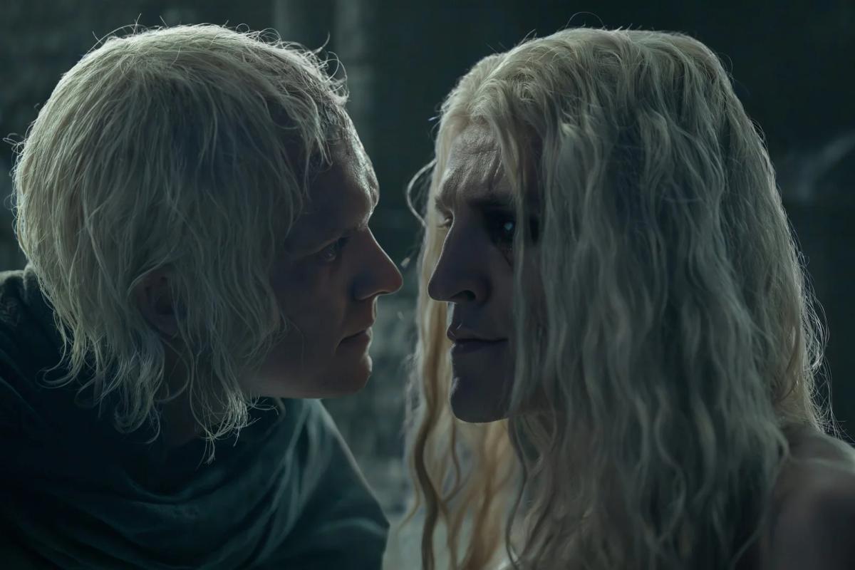 Tom Glynn-Carney as Aegon II and Ewan Mitchell as Aemond Targaryen face to face in close-up, Aemond in tears