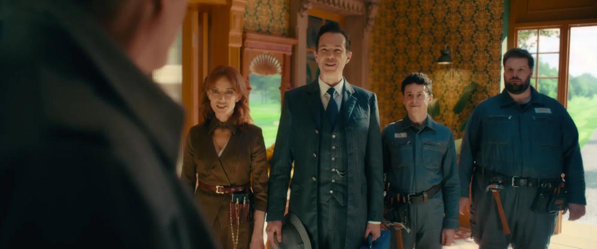 Orla Brady as F.R.I.D.A.Y., James D'Arcy as J.A.R.V.I.S., Jonathan Sayer as U. and Henry Lewis as D.U.M.-E. greet Vision in a brightly decorated hall in VisionQuest