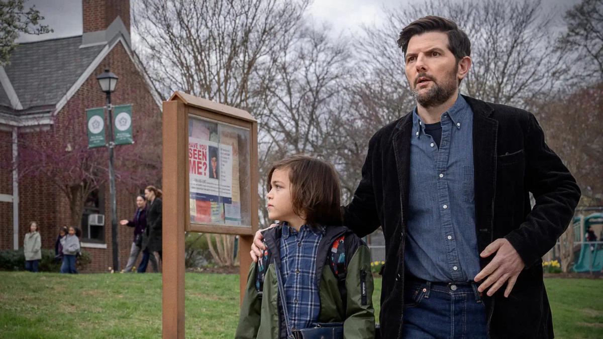 Robert De Niro as Pete Willis holding back Adam Scott as Tom Kennedy in a corridor, with Michelle Monaghan as Amanda Beck behind them.