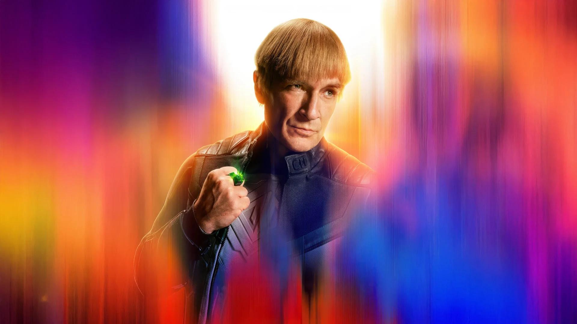 Official Superman character poster of Nathan Fillion as Guy Gardner, holding a glowing green power ring against a blurred band of colour.