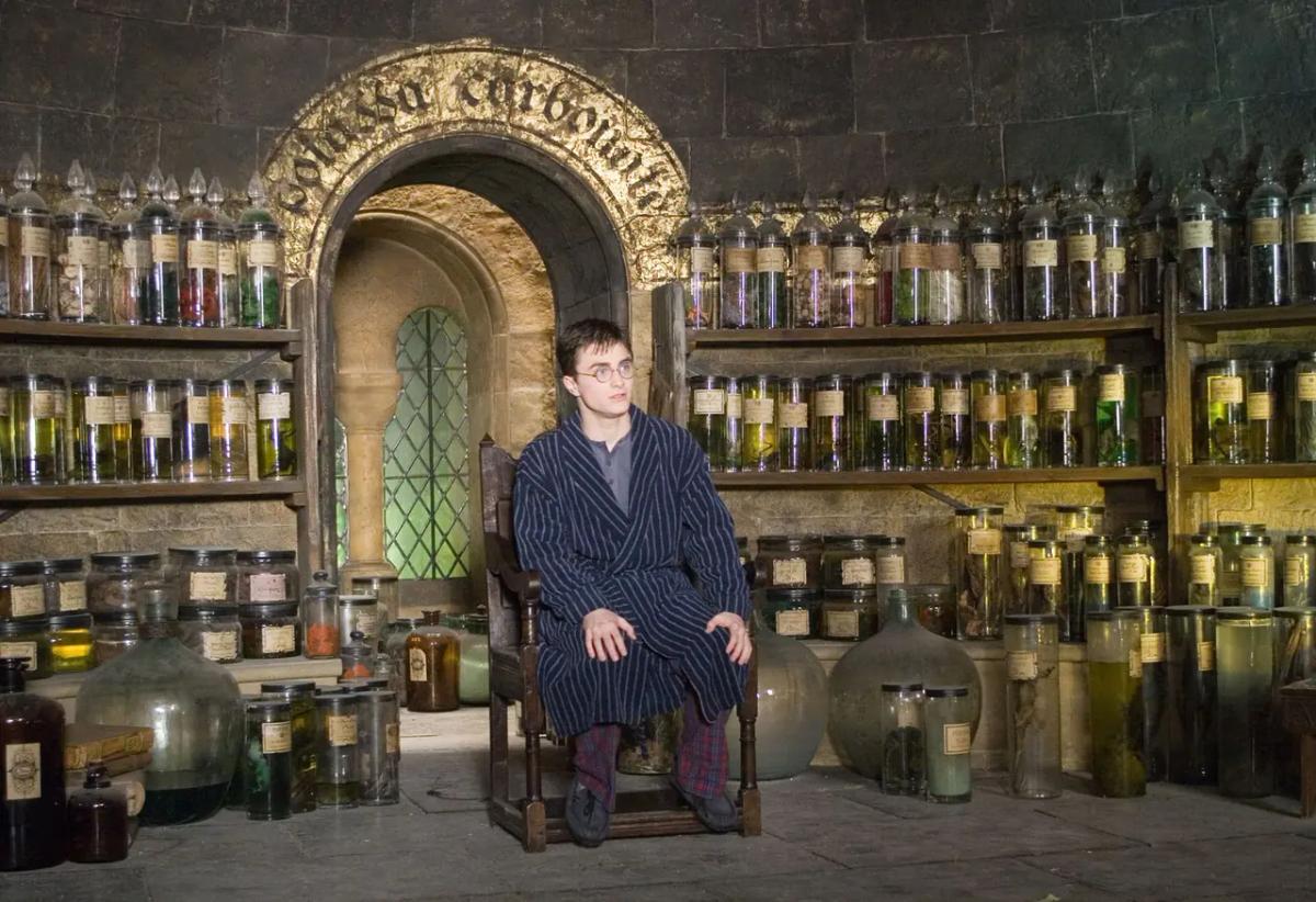 Daniel Radcliffe as Harry Potter seated in Severus Snape’s office for an Occlumency lesson