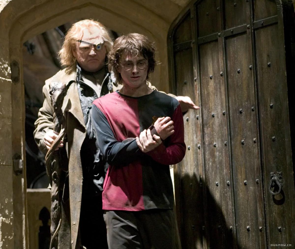 Brendan Gleeson as Alastor Moody leads Daniel Radcliffe as Harry Potter away after his return from the graveyard.