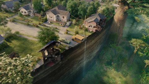 Aerial view of a suburban street sheared off mid-block, houses and a school bus at the lip of a sheer drop into prehistoric forest.