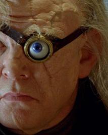 Brendan Gleeson as Alastor Moody faces forward with his magical eye visible.