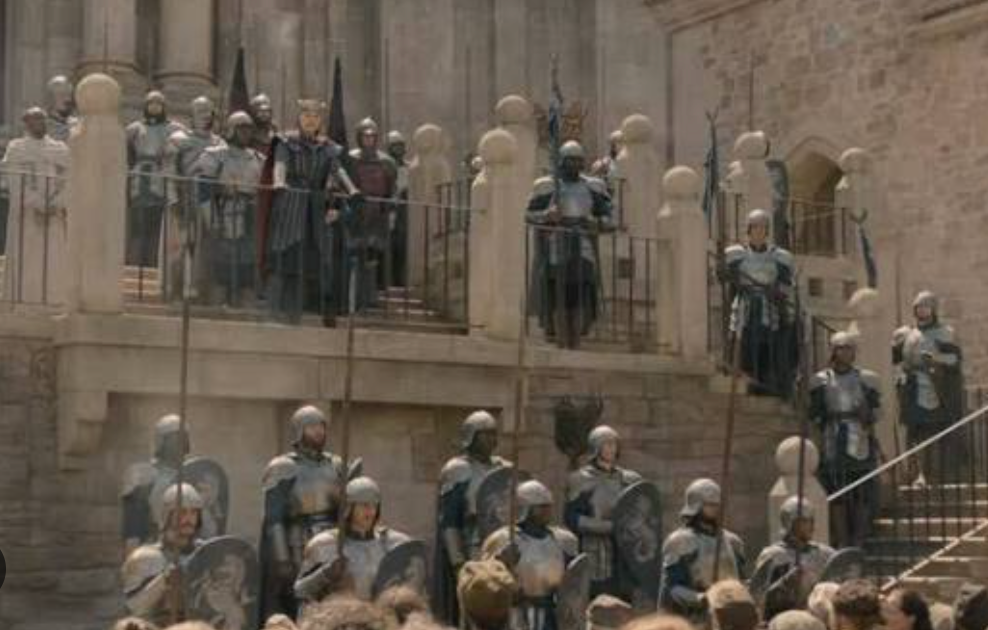 Armored soldiers lining the steps and balcony of the sept, holding back a crowd of smallfolk below