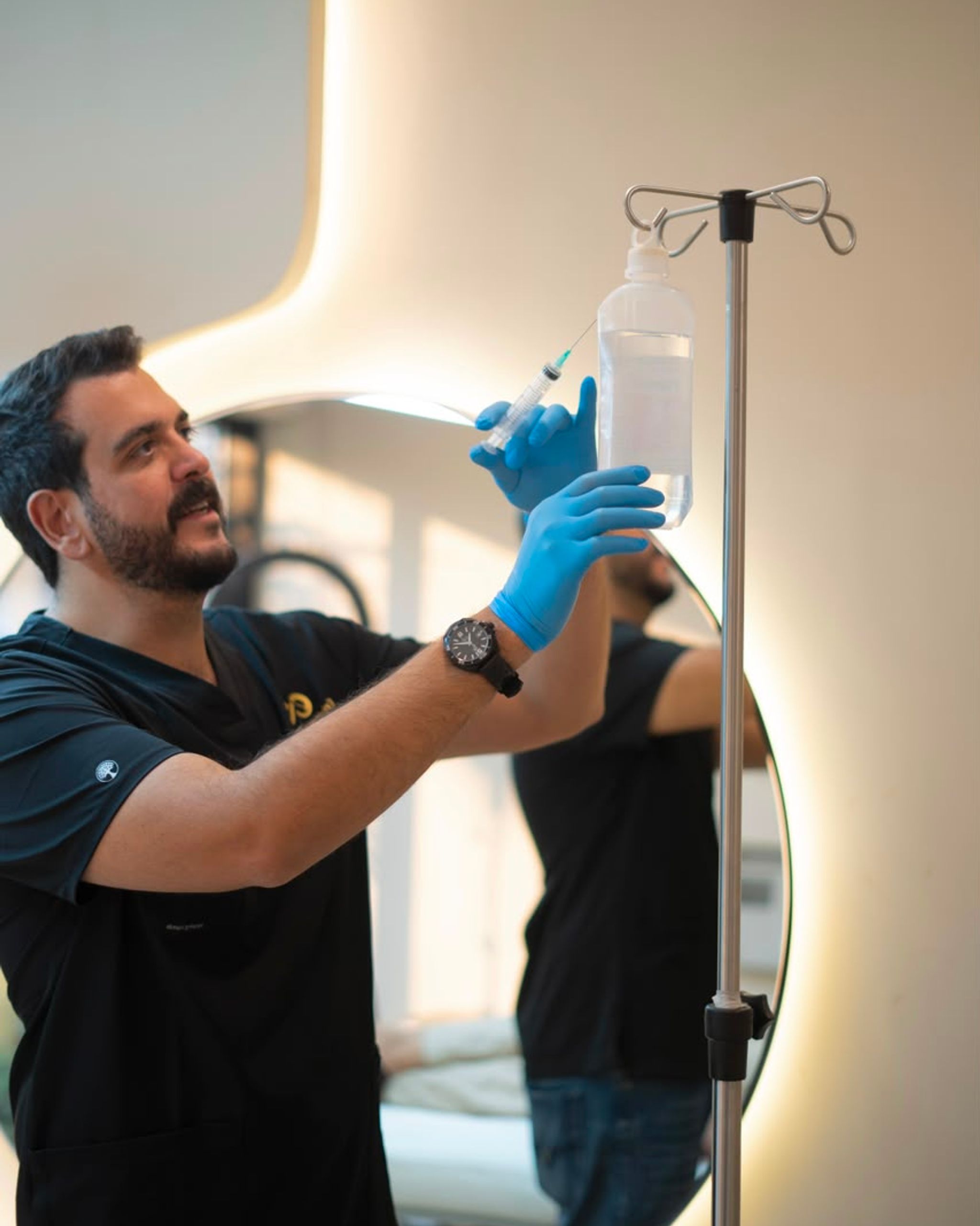 Healthcare professional preparing an IV bag