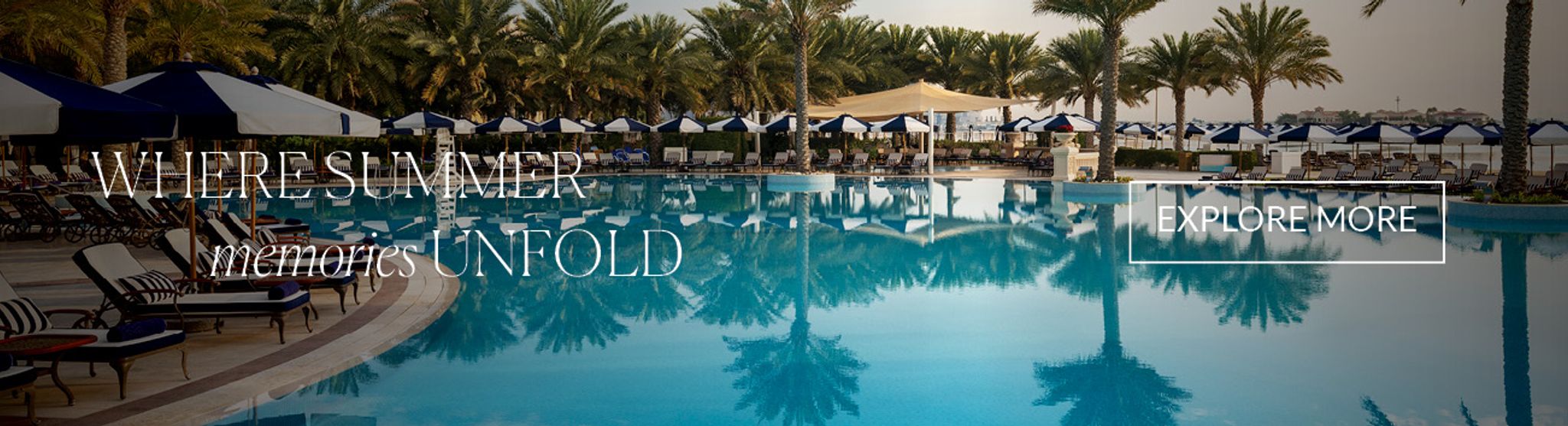 Palm-lined pool and resort setting at Raffles The Palm Dubai