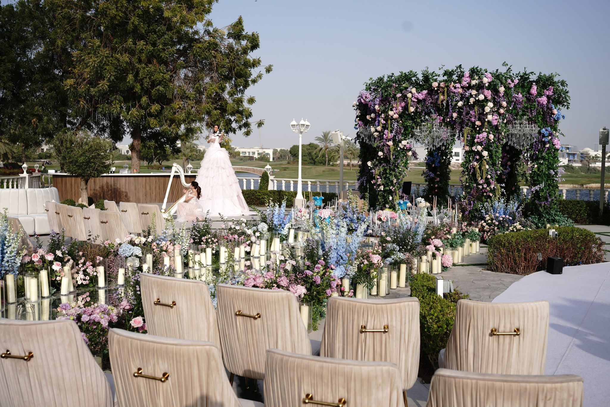 Ivory ceremony chairs facing the floral canopy at Four Seasons Resort Dubai at Jumeirah Beach
