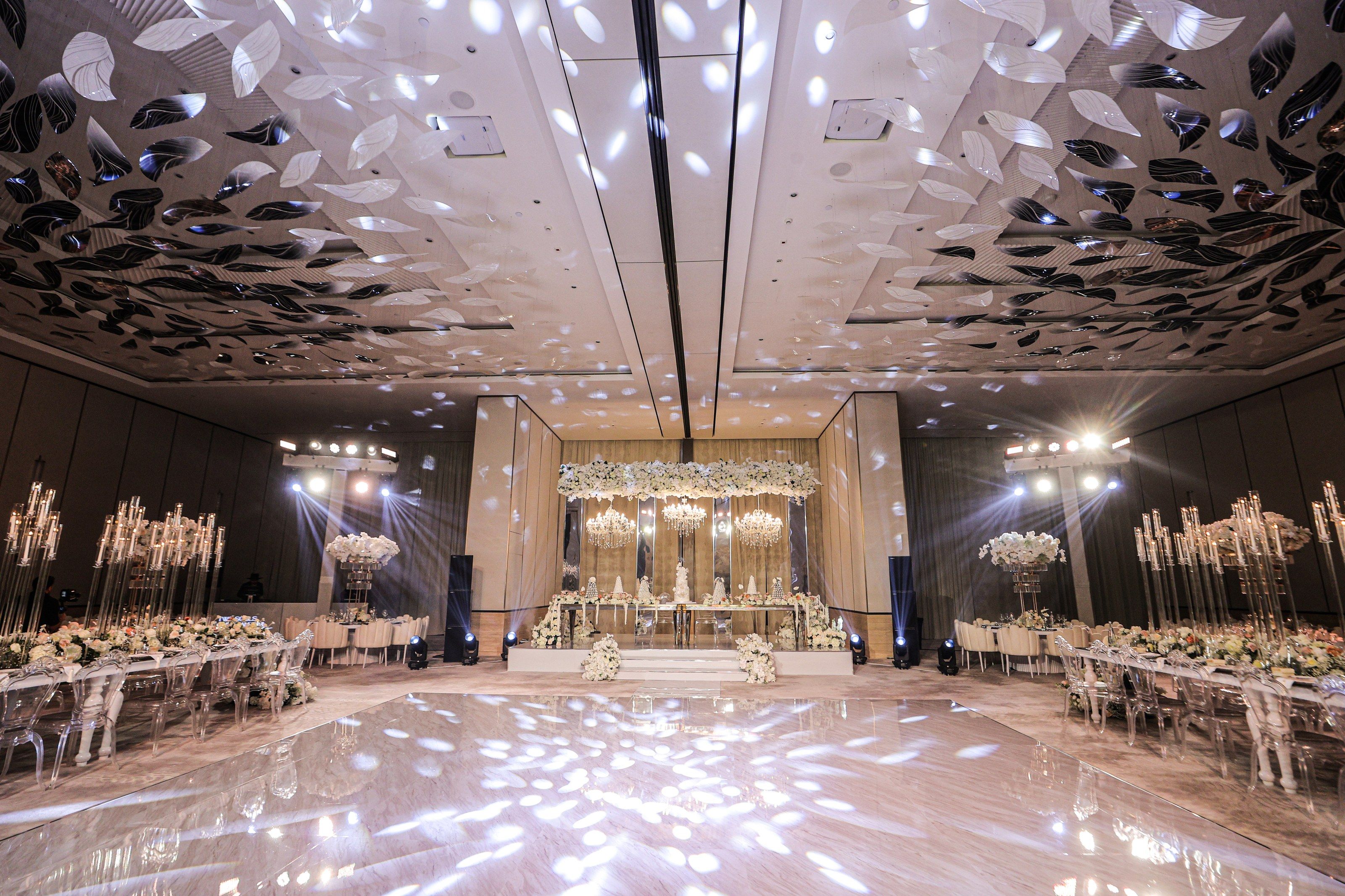 Ballroom at The St. Regis Dubai, The Palm with a mirrored dance floor, sculpted leaf ceiling and floral stage
