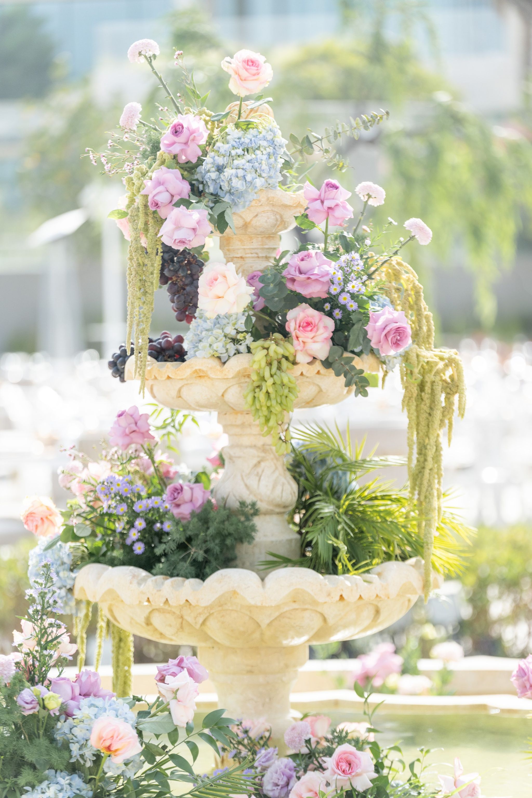 Tiered fountain overflowing with roses, hydrangea and grapes at Four Seasons Resort Dubai at Jumeirah Beach