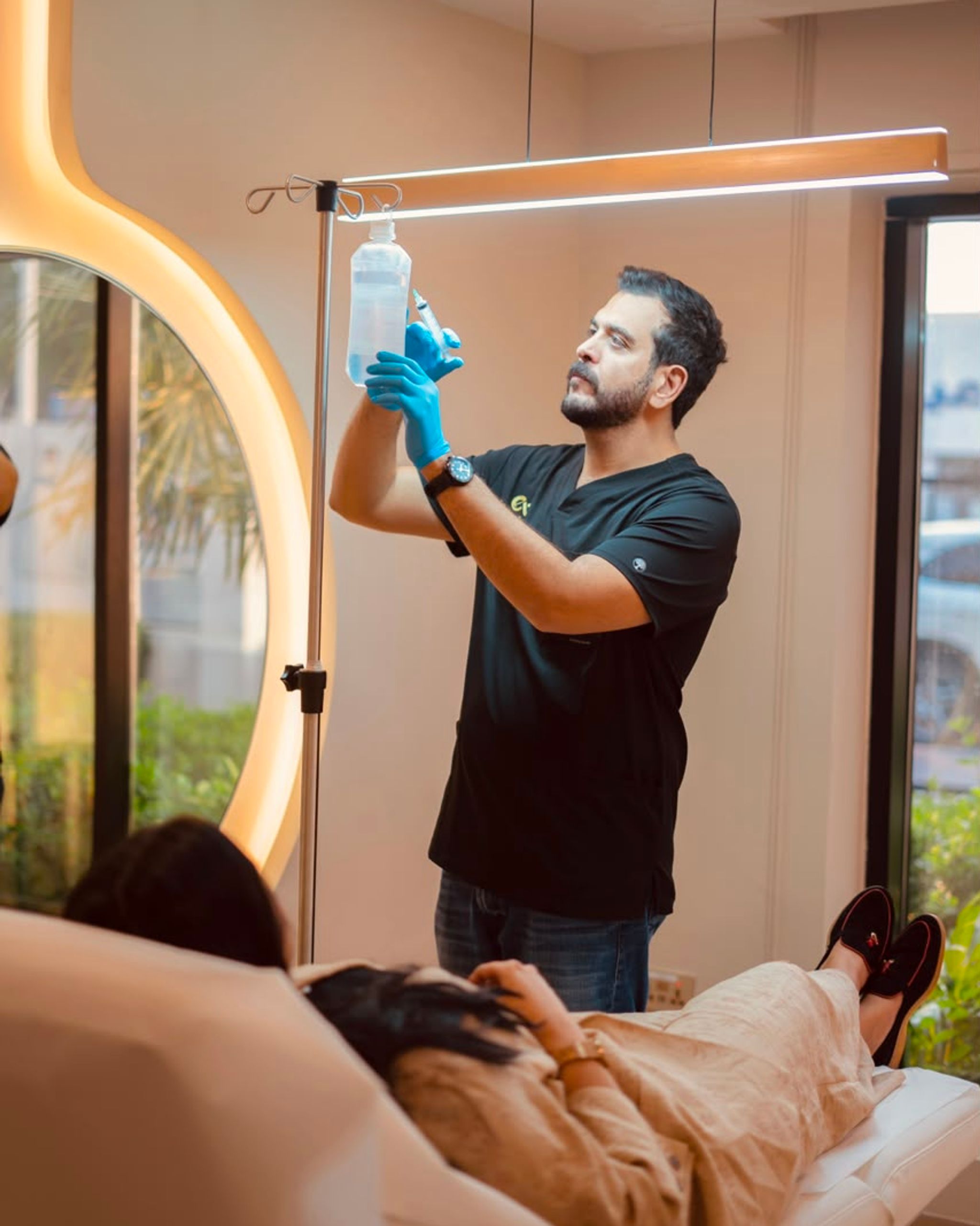 Licensed healthcare professional preparing an IV wellness treatment