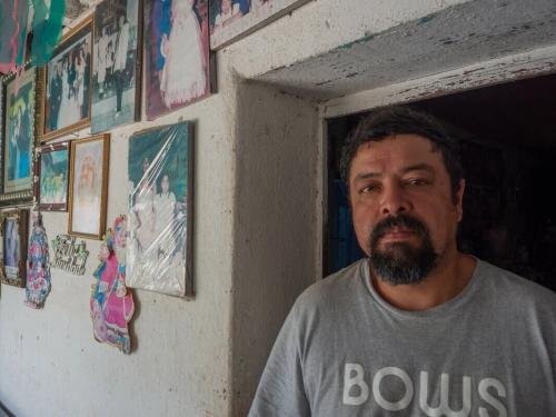 Guatemala: Alexander Reynoso Bran with photos of his daughter. She was an anti-mine activist who was assassinated when she was 16. Reynoso was badly injured in the attack. Photo: Elizabeth Stevens/Oxfam