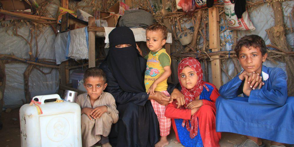 Daoshah-with-her-children-waiting-for-help-in-the-temporary-tent_They-lost-their-father-in-the-conflict