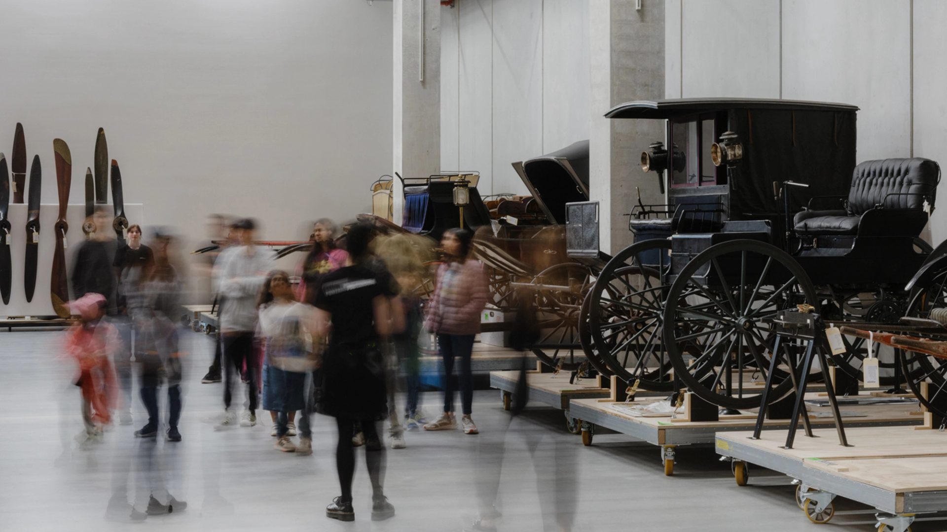 Photo of a group of people viewing collection objects at Powerhouse Castle Hill.