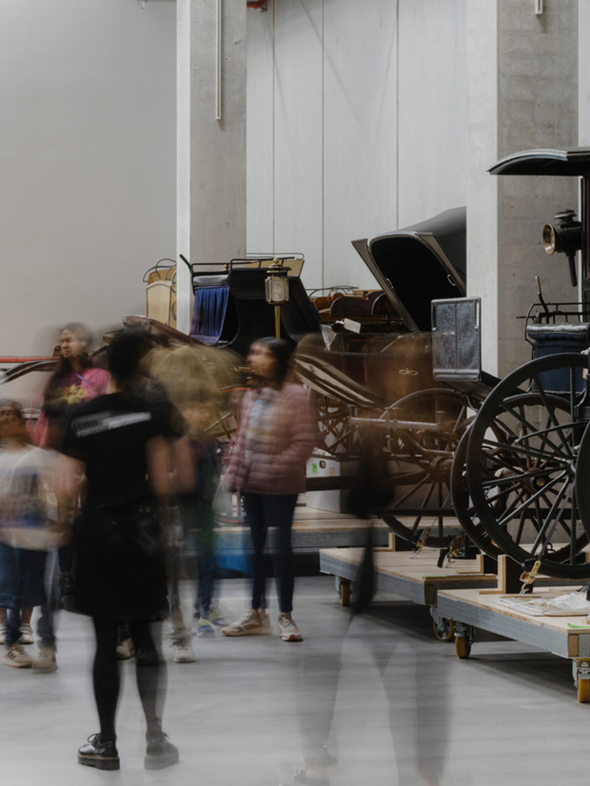 Photo of a group of people viewing collection objects at Powerhouse Castle Hill.