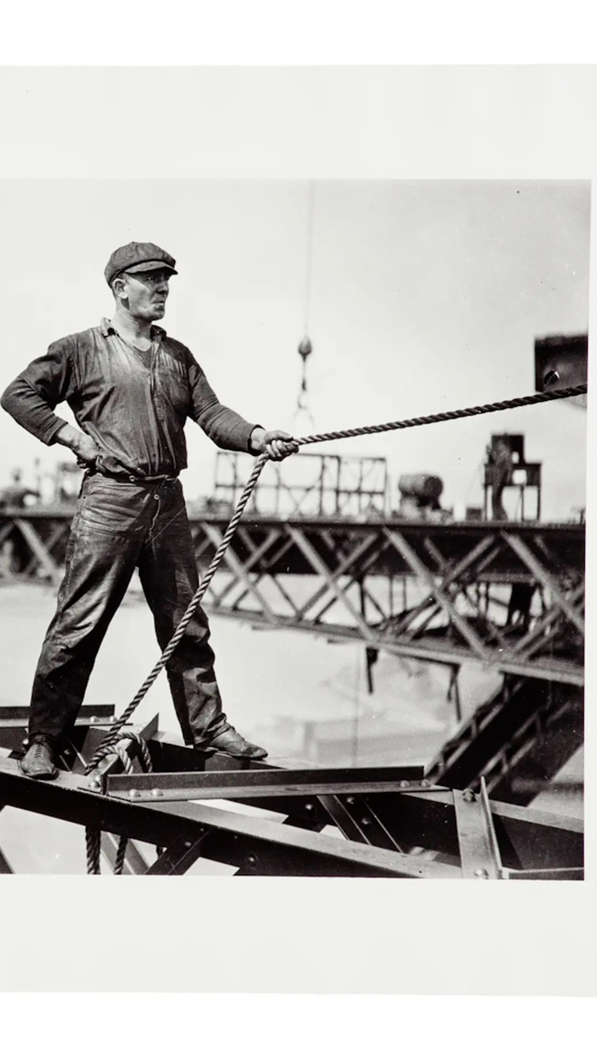 The images document the construction of the Sydney Harbour Bridge. Each print has a white border. Sign from exhibition and copy negative of sign.