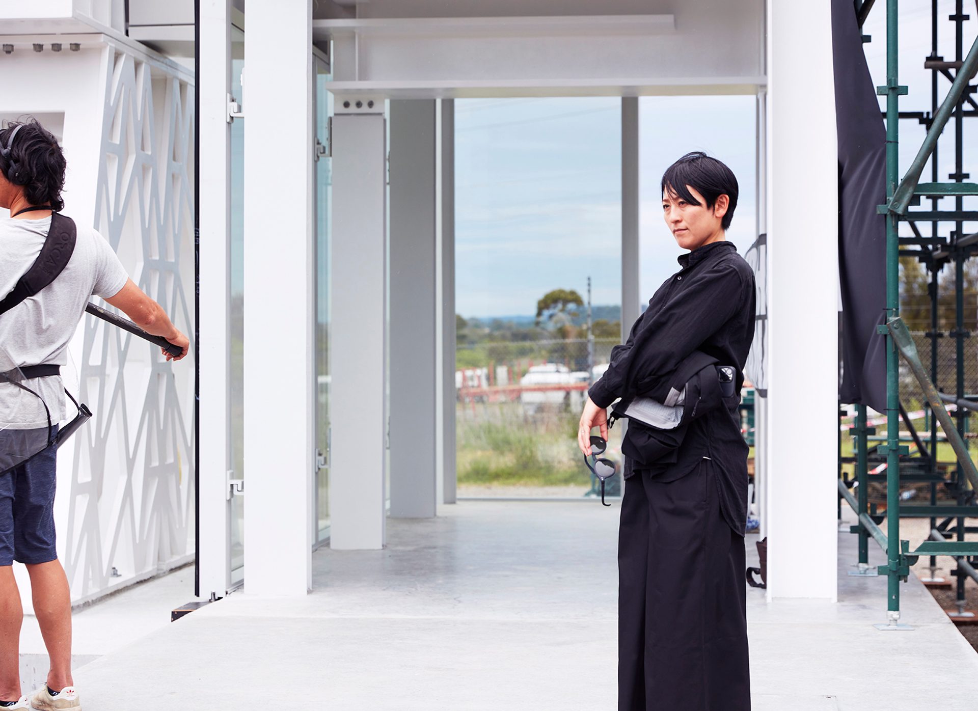 person standing by themselves next to exoskeleton