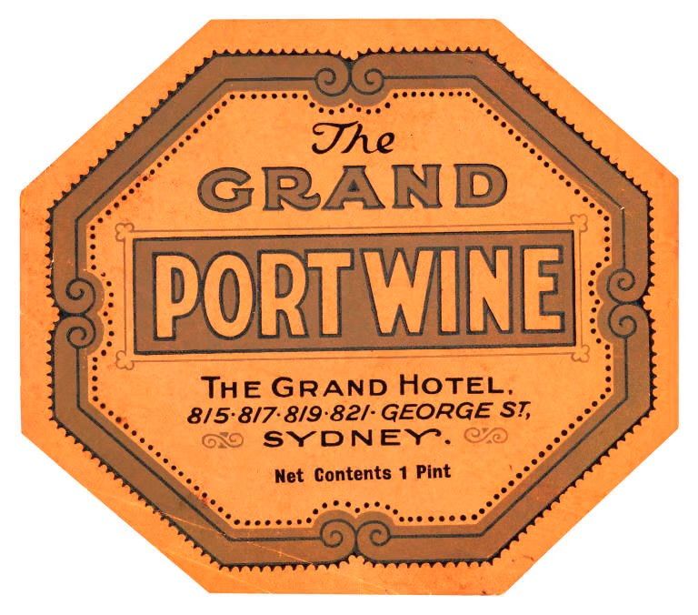 An orange wine bottle label. Text includes ‘THE GRAND PORT WINE’.