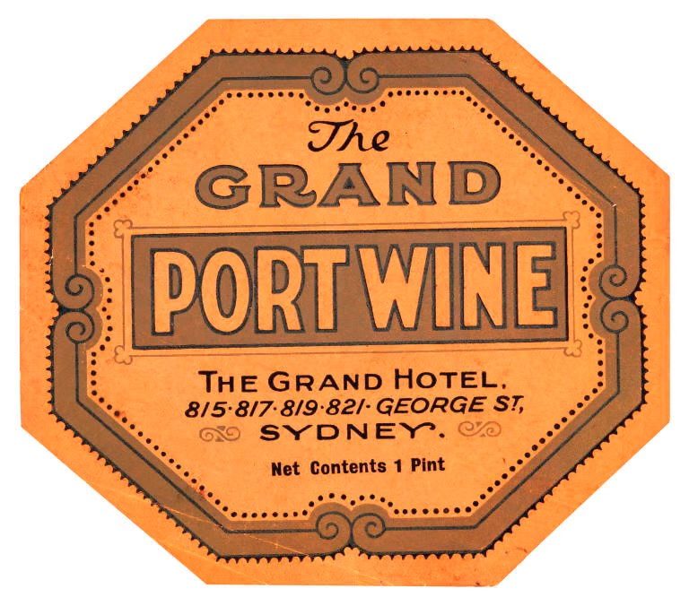 An orange wine bottle label. Text includes ‘THE GRAND PORT WINE’.