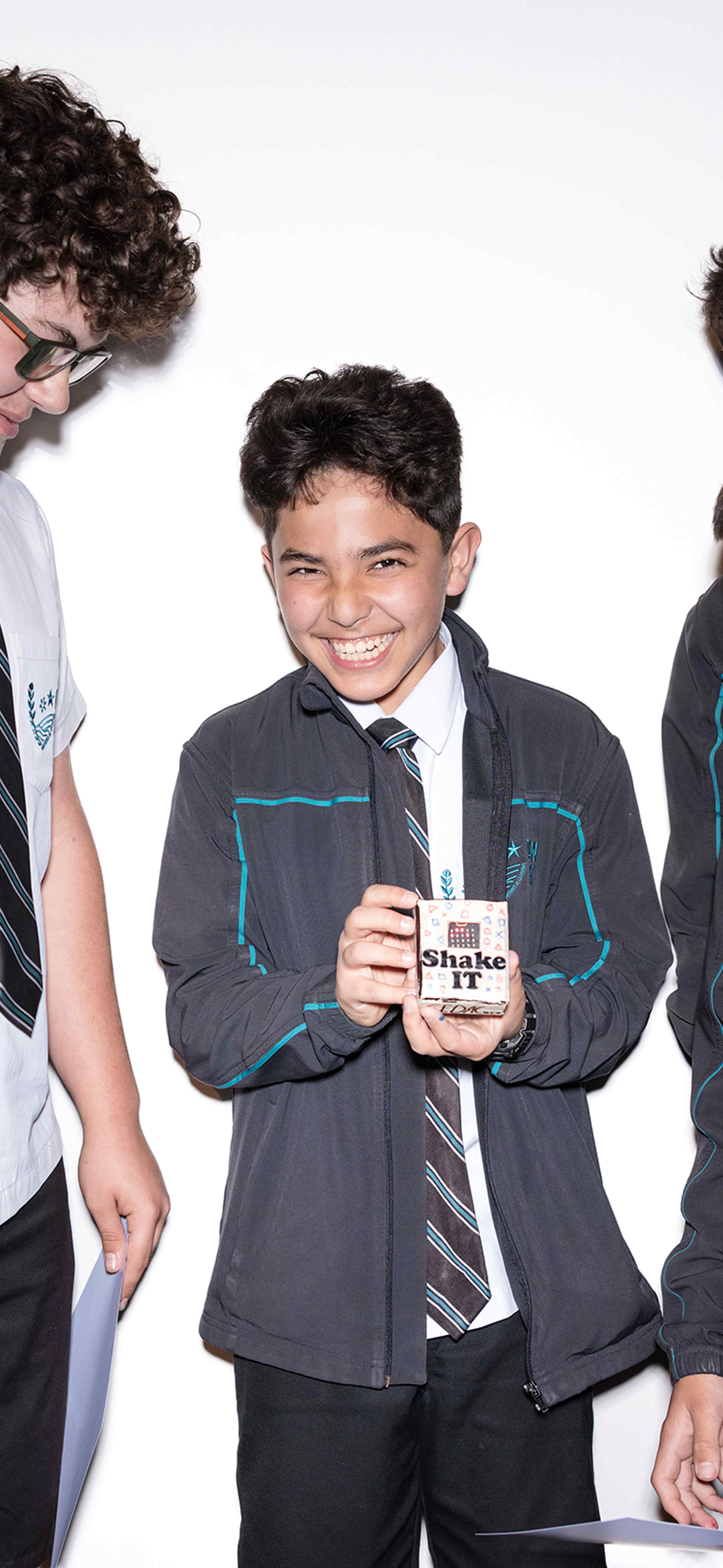 Give school boys in uniform look at their prototype