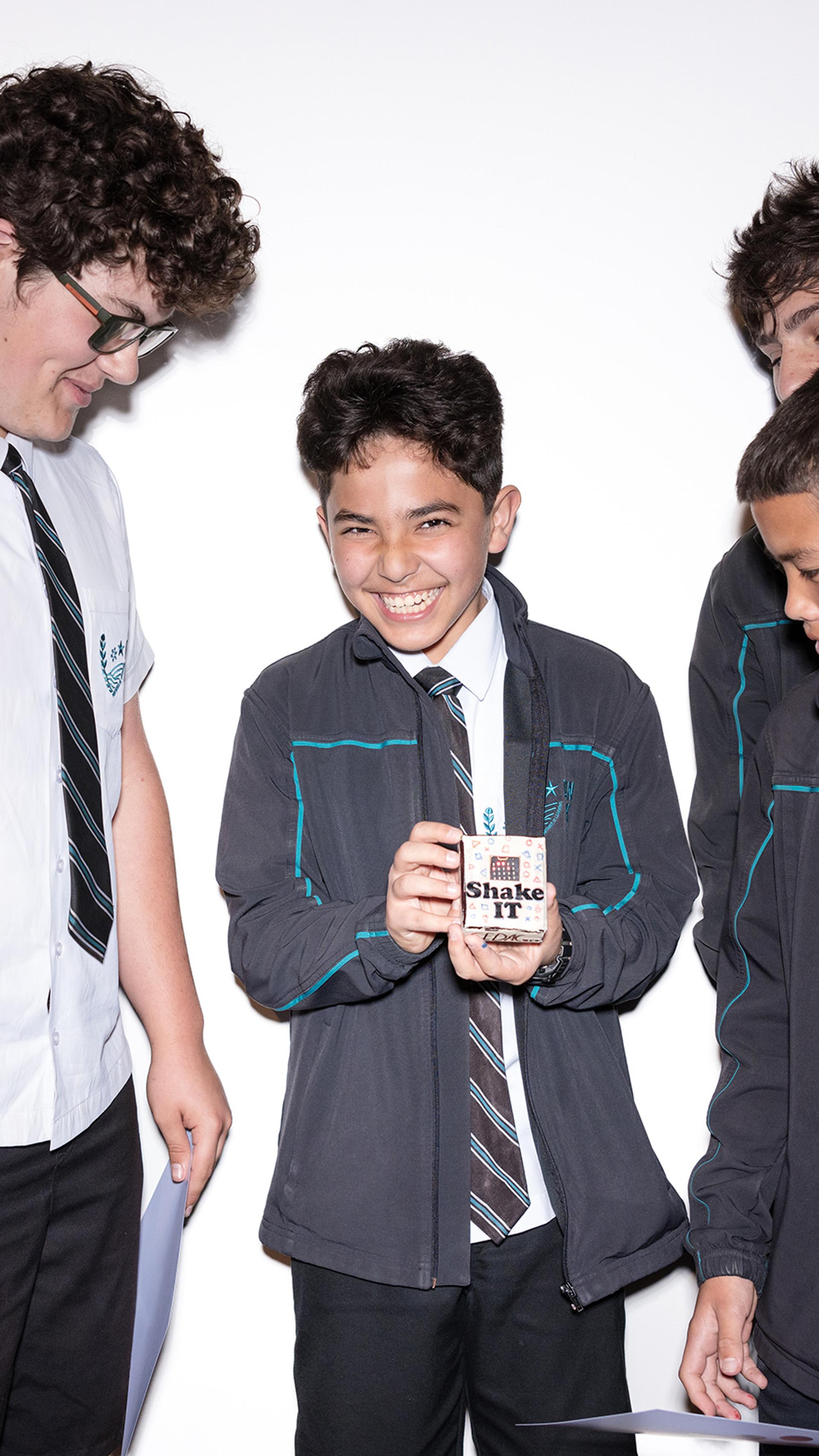 Give school boys in uniform look at their prototype