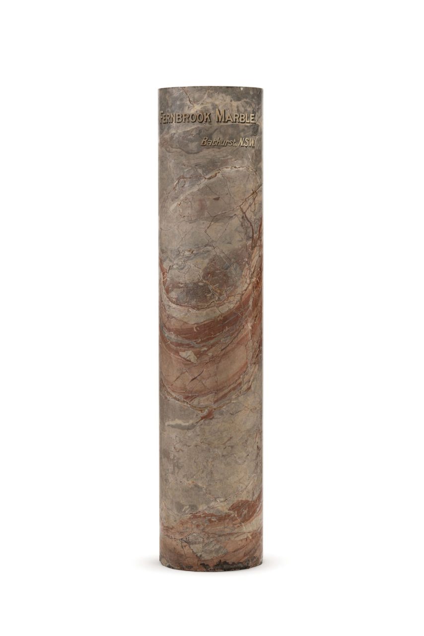 Museum collection photograph of marble pillar on white background