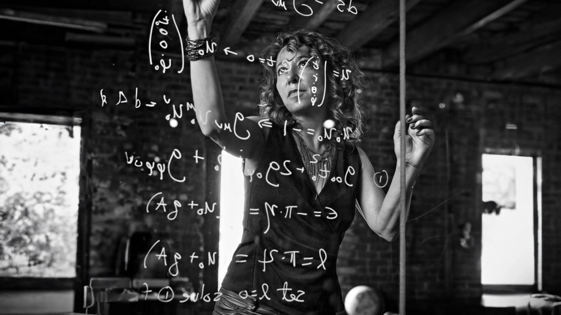 Woman writing on glass.