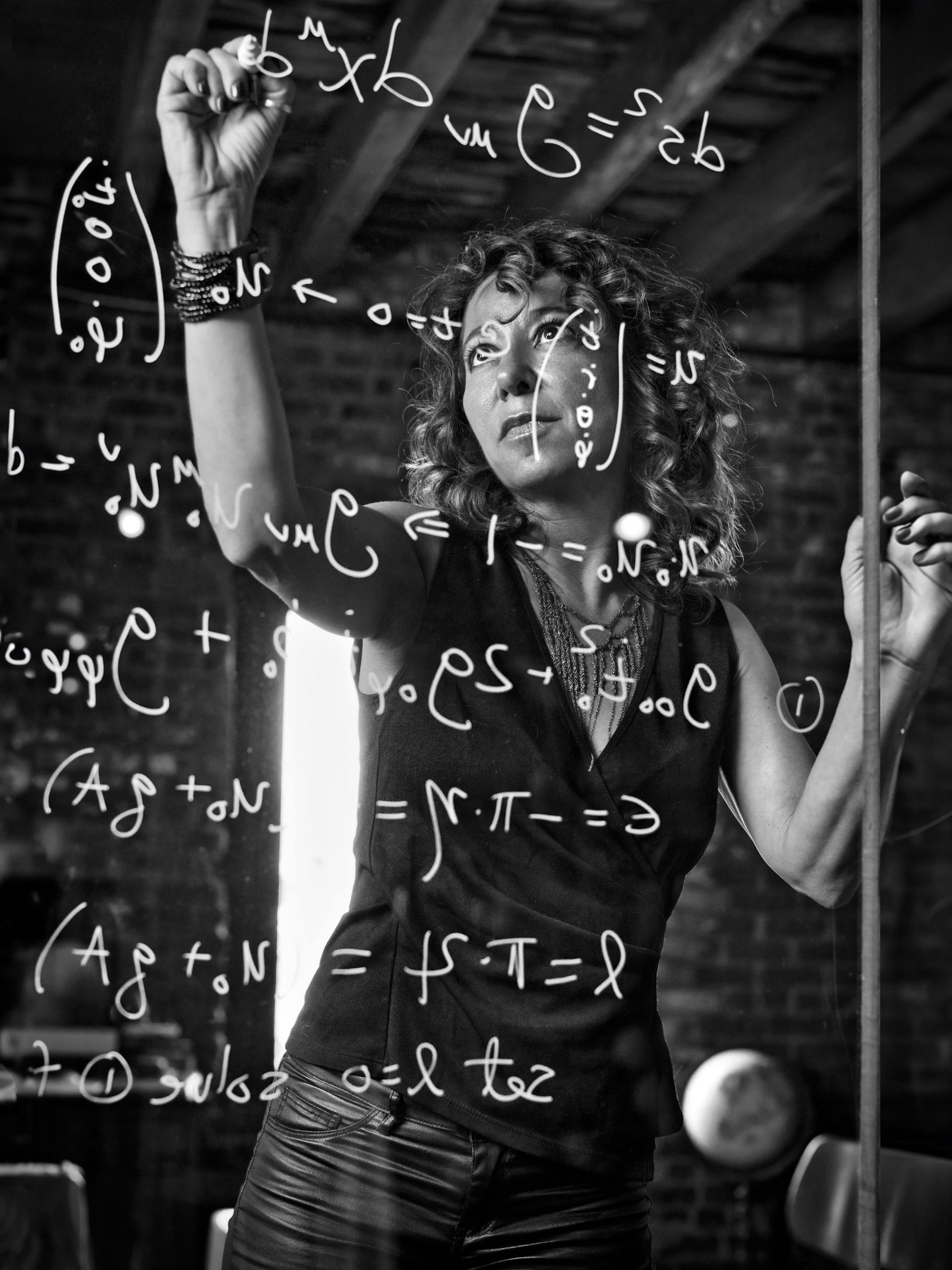 Woman writing on glass.
