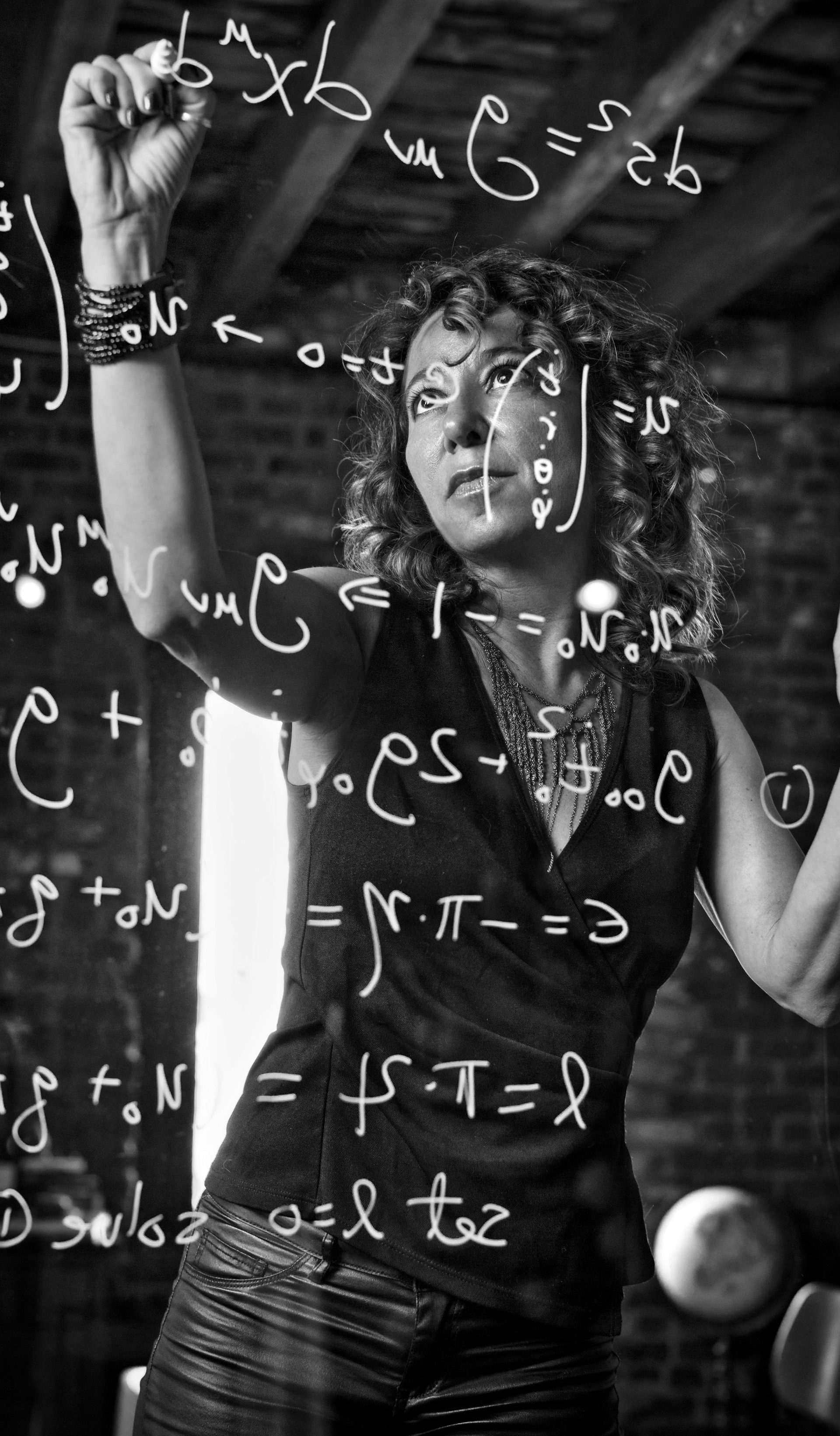 Woman writing on glass.
