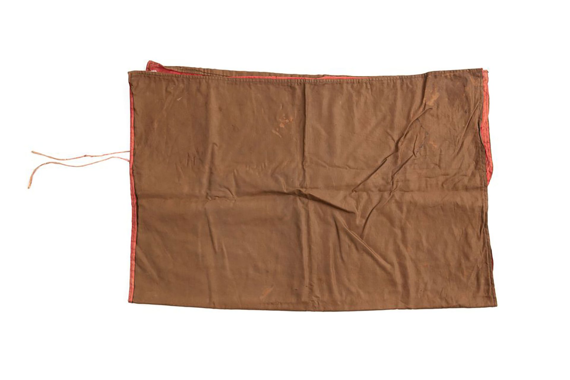Camera shroud in the form of a rectangle of brown textile lined on the inside with red fabric.